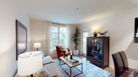 Located at 610 E Union St in Pasadena, California, this single-floor residence offers a thoughtfully designed layout with comfortable living spaces and modern finishes throughout. The open living room is bathed in natural light from large windows dressed with sheer white curtains, creating a warm and welcoming ambiance. Light wood-style flooring runs throughout the unit, contributing to a clean, contemporary aesthetic. A door from the living area provides direct access to an outdoor space, enhancing the connection to the surroundings.

The kitchen is equipped with stainless steel appliances, including a full-size refrigerator, and features warm wood cabinetry alongside a practical entry area. The space is complemented by an in-unit washer and dryer tucked neatly behind a closet door, offering added convenience.

The primary bedroom is distinguished by a rich, warm accent wall and includes a generously sized walk-in closet with built-in shelving and hanging rods, providing ample storage. The en-suite bathroom offers a wide vanity with wood cabinetry, a large mirror, and a combination tub and shower. A second bedroom provides a serene retreat with neutral tones and its own dedicated bathroom. Together, these spaces deliver a functional and comfortable living environment in the heart of Pasadena.