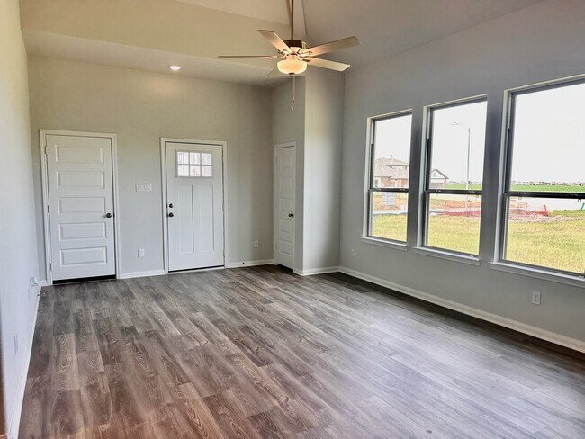 The modern flooring and ceiling fan immediately elevate this space! - 730 Tejas Village Pky