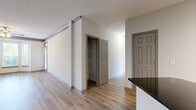 Located in Brookhaven, GA, this well-designed single-floor residence offers three bedrooms, three bathrooms, and three closets within a thoughtfully laid-out floor plan. Light wood flooring flows consistently throughout, creating a clean and cohesive aesthetic across all living spaces.

The kitchen is a functional highlight, featuring stainless steel appliances including a refrigerator, range, and over-the-range microwave, complemented by white cabinetry with glass-front accents, dark granite countertops, and a tile backsplash with a mosaic pattern. The adjacent living room benefits from crown molding details and direct access to the entry.

The bedrooms are bright and generously proportioned, each equipped with ceiling fans and windows that invite natural light. The primary bedroom features a bay window configuration that enhances its sense of openness and connection to the outdoors. Each bedroom is paired with dedicated closet space, including walk-in closets fitted with wire shelving systems for practical storage.

The bathrooms are finished in a clean, neutral palette with white tiled tub-shower combinations, chrome fixtures, and wood-look flooring. Throughout the home, a consistent use of light tones, textured ceilings, and natural light contributes to a bright and welcoming ambiance.