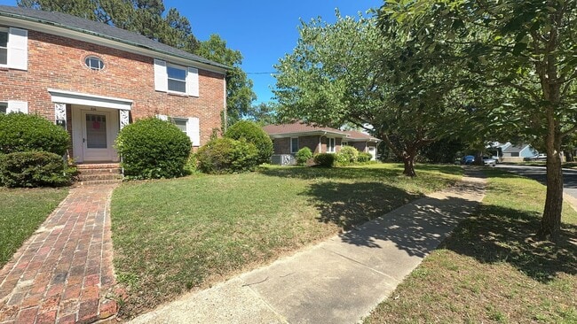 Building Photo - Charming 2BR with Sunroom, Hardwood Floors & Lawn Care Included