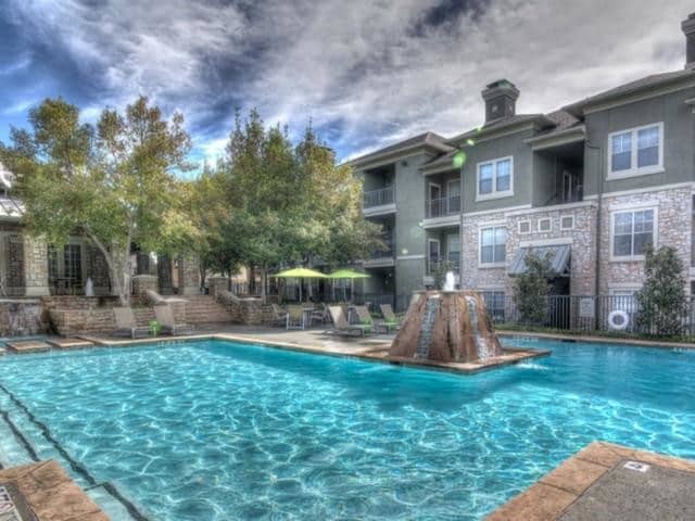 Swimming pool with outdoor lounge chairs - The Pavilions