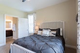 Located at 299 Harris Ln in Gallatin, Tennessee, this single-floor residence offers a thoughtfully designed layout with a warm, neutral color palette and consistent finishes throughout. The open living room is generously proportioned, featuring crown molding, wood-look flooring, and large windows that invite abundant natural light and views of the surrounding neighborhood. A dedicated sitting area flows seamlessly from the living space, providing a comfortable retreat with additional natural light.

The kitchen is a standout feature, showcasing rich dark cabinetry, granite countertops, a classic white subway tile backsplash, and stainless steel appliances including a dishwasher and range. Pendant lighting and built-in shelving with an arched accent add character and function. Adjacent to the kitchen, the dining area offers a cozy space with wood-look flooring and a welcoming ambiance.

The bedrooms are carpeted for comfort and equipped with ceiling fans, generous windows, and ample natural light. Each room provides a serene atmosphere ideal for rest. The bathrooms are finished with dark vanity cabinetry, granite countertops, and wood-look tile flooring. One bathroom features a spacious vanity with a lighted mirror, while another includes a tub-shower combination with a window for ventilation and light.