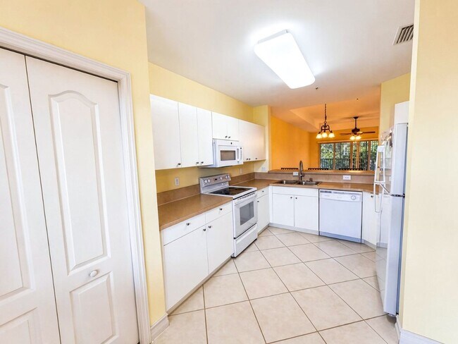 Building Photo - AVAILABLE NOW! Top-Floor Condo | Gated Community | Preserve Views | Water, Sewer & Cable Included