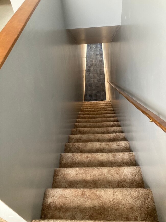 staircase to apartment - 310 N University Ave