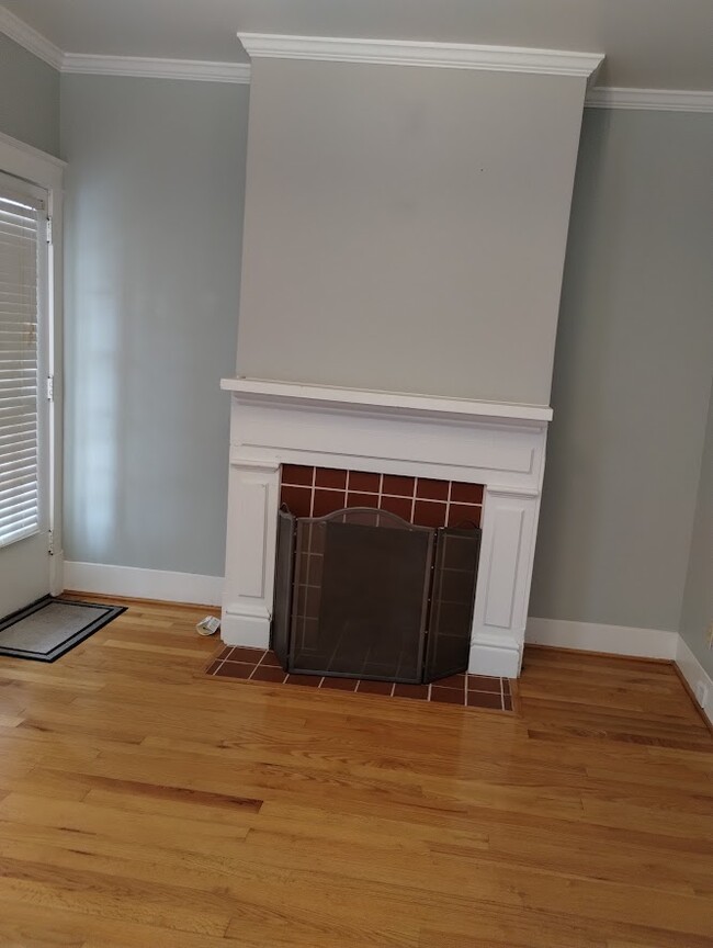 Decorative fireplace, and hardwood floors throughout the property. - 500 N 16th St