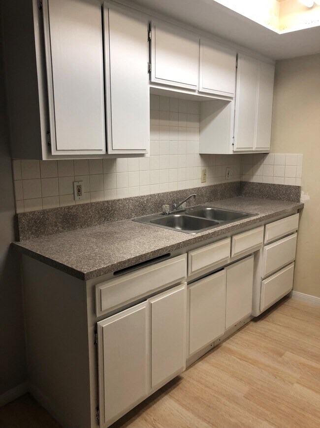Kitchen cabinets and granite countertops, new flooring, new baseboards, new paint - 695 Massachusetts Ave