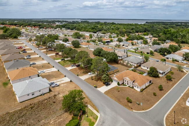 Aerial of Park Hill Home to Multicolored Ranch-Style Home in Sunnyside.
