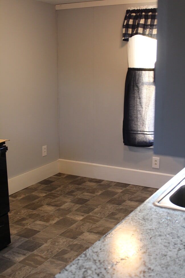 Perfect spot for a small table/pub table in the kitchen. - 1011 Main St