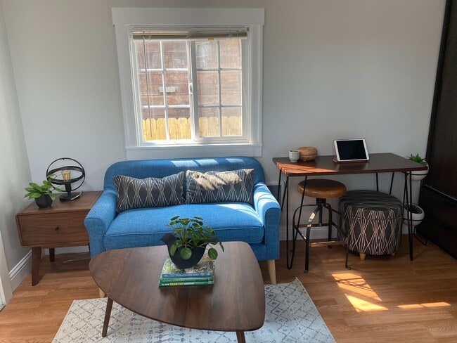 Gently used loveseat for $150 purchase. Small white heater next to it. - 2445 Harrington Ave