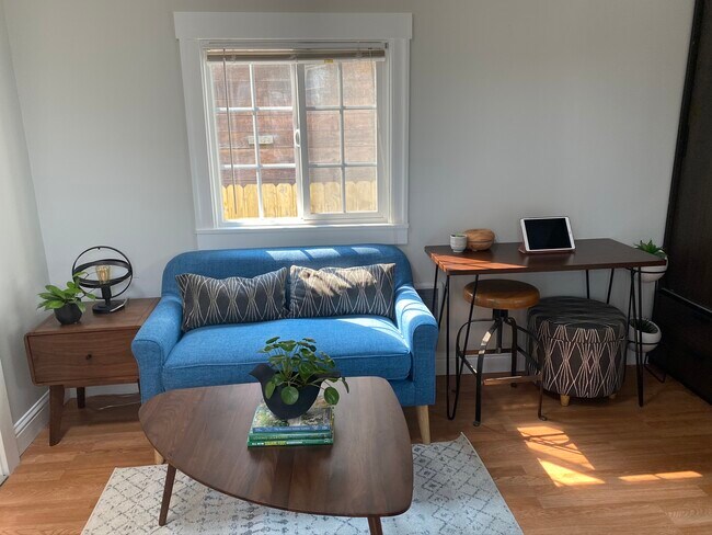 Gently used loveseat for $150 purchase. Small white heater next to it. - 2445 Harrington Ave