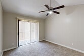 Located at 2305 Hayes Rd in Houston, TX, this single-floor, one-bedroom, one-bathroom residence offers a thoughtfully designed layout across a comfortable footprint. The living room is a standout space, featuring dramatic vaulted ceilings, a ceiling fan, soft carpeting, and a white-painted brick fireplace that anchors the room with warmth and character. Natural light flows in through a sliding glass door that opens to a private outdoor area, enhancing the open, airy feel of the living space.

The kitchen is well-equipped with grey cabinetry, white countertops, black appliances including a range and refrigerator, a built-in dishwasher, and a stylish mosaic tile backsplash. Light wood-style flooring runs throughout the kitchen, which connects seamlessly to a dedicated dining area illuminated by a pendant light.

The bedroom is a generous, carpeted retreat with a ceiling fan, a natural-light window with exterior views, and convenient access to a hallway with multiple closets for ample storage. The bathroom features a clean, bright design with a tub-shower combo, wood-style flooring, and a vanity with integrated sink. With four closets and a pantry, this residence offers exceptional storage throughout.