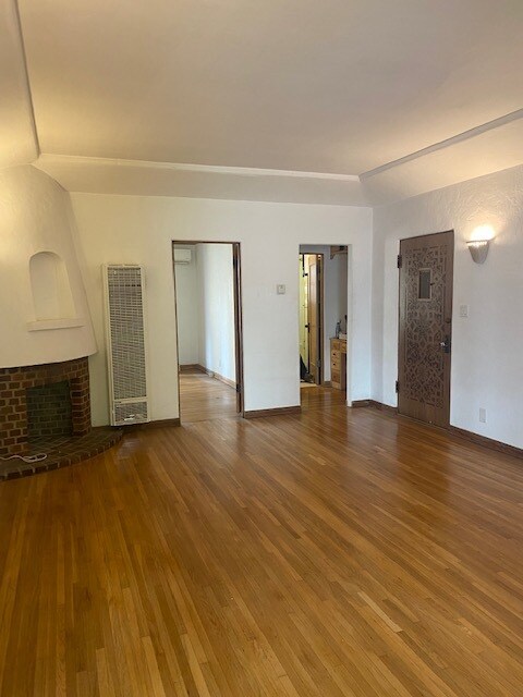 Living room bedroom door on left, vanity room on right - 126 S Maple Dr