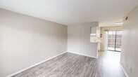 Located at 200 Brazoswood Drive in Clute, TX, this single-story 2-bedroom, 1-bathroom home offers a practical and comfortable layout designed for everyday living. The open living room greets you with neutral-toned walls and durable wood-look flooring that extends throughout the main living areas, creating a clean, cohesive aesthetic. Natural light filters in through large windows, adding brightness and warmth to the space. The living area flows seamlessly into the combined dining room and kitchen, where white cabinetry, light countertops, a stainless steel sink, and white appliances — including a range and refrigerator — provide a functional and tidy cooking environment. A pantry offers additional storage nearby. Both bedrooms feature plush carpeting and ceiling fans with light fixtures, contributing to a cozy atmosphere. The primary bedroom is a comfortable size and includes two dedicated closets, providing generous storage. The full bathroom is equipped with a tub-shower combo and overhead cabinetry for added convenience. Additional highlights include a laundry area, multiple closets throughout, a hallway connecting the main spaces, and a private patio perfect for outdoor relaxation. This home offers a straightforward, move-in-ready layout ideal for those seeking comfortable living in Clute, TX.