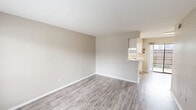 Located at 200 Brazoswood Drive in Clute, TX, this single-story 2-bedroom, 1-bathroom home offers a practical and comfortable layout designed for everyday living. The open living room greets you with neutral-toned walls and durable wood-look flooring that extends throughout the main living areas, creating a clean, cohesive aesthetic. Natural light filters in through large windows, adding brightness and warmth to the space. The living area flows seamlessly into the combined dining room and kitchen, where white cabinetry, light countertops, a stainless steel sink, and white appliances — including a range and refrigerator — provide a functional and tidy cooking environment. A pantry offers additional storage nearby. Both bedrooms feature plush carpeting and ceiling fans with light fixtures, contributing to a cozy atmosphere. The primary bedroom is a comfortable size and includes two dedicated closets, providing generous storage. The full bathroom is equipped with a tub-shower combo and overhead cabinetry for added convenience. Additional highlights include a laundry area, multiple closets throughout, a hallway connecting the main spaces, and a private patio perfect for outdoor relaxation. This home offers a straightforward, move-in-ready layout ideal for those seeking comfortable living in Clute, TX.
