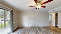 Located at 2409 Meadowbrook Avenue in New Bern, North Carolina, this single-story, three-bedroom, one-bathroom home offers a practical and well-appointed layout. Throughout the home, wood-look luxury vinyl plank flooring adds warmth and continuity, complemented by crisp white crown molding and neutral warm-beige walls that create a clean, cohesive aesthetic.

The kitchen is a functional centerpiece, featuring gray shaker-style cabinetry, light countertops, and black appliances including a range, dishwasher, and refrigerator. Natural light flows in through a window near the entrance, brightening the space.

The primary bedroom is generously sized and includes a ceiling fan with light fixture and a dedicated closet area with laundry hookups — a convenient feature for everyday living. The two additional bedrooms each offer closet storage, natural light from windows with blinds, and the same consistent flooring found throughout the home. Crown molding adds a refined touch to each room.

The bathroom features a full tub-shower combination with white tile surround. A central hallway connects the bedrooms to the main living areas, supporting an efficient and functional flow throughout this well-maintained home.