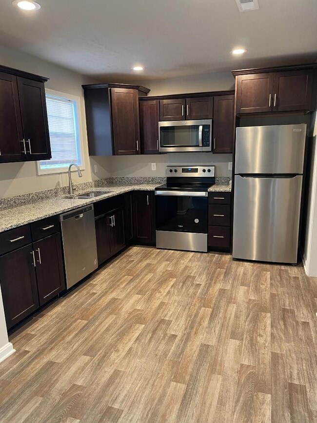 Building Photo - Modern Kitchen • Walk-In Closet • Private Primary Suite