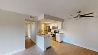 Located at 3303 South Archibald Avenue in Ontario, CA, this single-floor, 2-bedroom, 1-bathroom residence offers a functional and comfortable layout. The open-concept living and kitchen area serves as the heart of the home, featuring warm wood-look laminate flooring and a ceiling fan. The kitchen is well-equipped with a peninsula featuring a built-in sink, stainless steel appliances including a refrigerator, electric range, microwave, and dishwasher, complemented by white cabinetry and neutral countertops. The living area provides a bright, welcoming space with a front entry door. Both bedrooms are carpeted and bathed in natural light through windows fitted with blinds. The primary bedroom includes a spacious walk-in closet with wire shelving, while the second bedroom features a sliding-door closet. The full bathroom is clean and practical, offering a tub-shower combination, toilet, and a vanity with a large mirror. A dedicated laundry room houses a full-size washer and dryer. The overall ambiance is clean, neutral, and move-in ready, making it a practical and comfortable home.