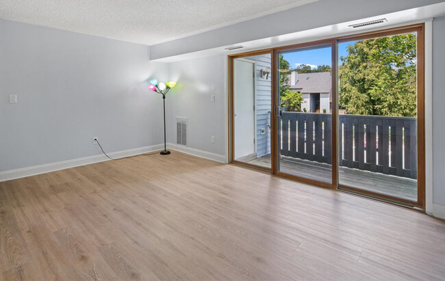 Triple sliding doors with thermo-pane glass for energy efficiency. - 1206 Aspen Dr