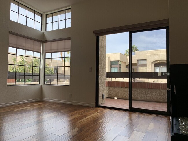 living room, balcony, fireplace facing north - 2601 S Broadmoor Dr