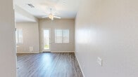 Located at 9102 E Boise St in Mesa, Arizona, this single-story, one-bedroom, one-bathroom home offers a thoughtfully designed layout with contemporary finishes throughout. Wood-look plank flooring runs consistently across the living areas, bedroom, and bathroom, creating a cohesive and easy-to-maintain interior aesthetic. Neutral, warm-toned walls complement the light-filled spaces, with window blinds providing adjustable natural light in every room.

The kitchen is a standout feature, equipped with crisp white cabinetry, granite-style countertops, a peninsula for additional prep space, and a full suite of stainless steel appliances including a refrigerator, electric range, microwave, and dishwasher. Recessed lighting and a window overlooking the exterior add both function and brightness to the space.

The bedroom is a well-proportioned, private retreat with a dedicated window that allows natural light to filter in. The bathroom features a dual-sink vanity with granite countertops, white cabinetry, large mirrors, and convenient access to a closet. The clean, minimalist design of the bathroom contributes to the overall modern feel of the home.

A 3D dollhouse view reveals an attached private outdoor area, adding valuable exterior space to this efficient and well-appointed Mesa residence.