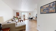 Located at 138 South Atherton Street in State College, PA, this one-bedroom, one-bathroom unit offers a thoughtfully arranged single-floor layout with a comfortable and functional living experience. The open living and dining area is bright and welcoming, featuring light wood-style flooring, white walls, and a sliding glass door that invites natural light while providing outdoor access. The living space flows seamlessly into the dining area, making the combined room feel open and versatile. The generously sized bedroom features plush carpet flooring, a wide window with natural light, and ample space for a full furniture arrangement including a bed, dresser, and desk area. Three closets throughout the unit provide excellent storage options. The kitchen is efficiently designed with warm wood cabinetry, tile flooring, and full appliances including a range and refrigerator. The full bathroom features classic tile flooring, a combined tub and shower with sliding glass doors, and a wood-toned vanity. A hallway connects the rooms with ease, adding to the unit's organized flow. With three closets spread throughout, storage is a practical highlight of this well-rounded home.