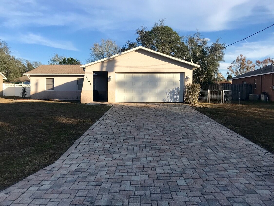 Large driveway with two-car garage. - 5398 Colchester Ave