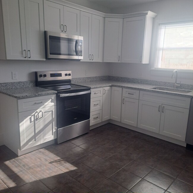 Freshly renovated kitchen with all new appliances and cabinets - 12 Tiffany St