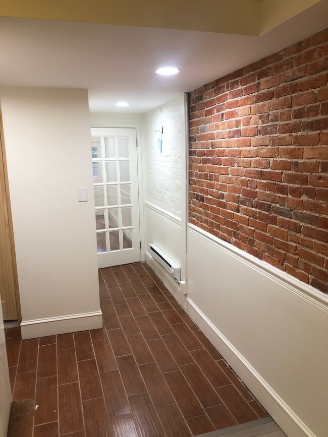 Hallway with exposed brick - 623 S Carolina Ave SE