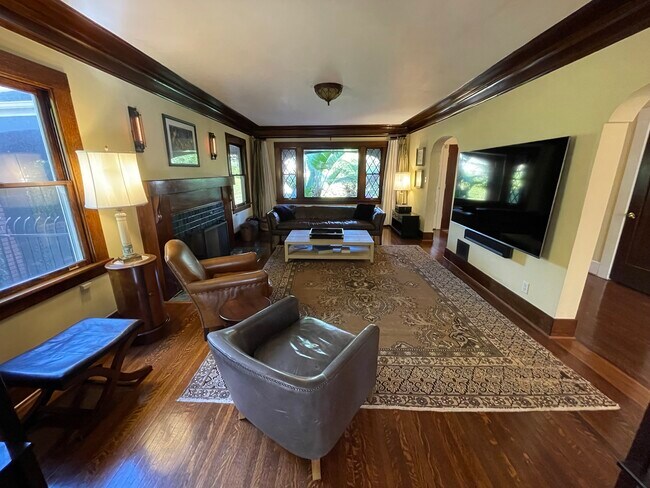 Living Room with 86" TV and Wood Burning Fireplace - 2106 S Victoria Ave