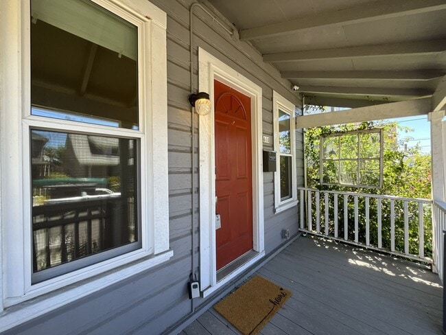 Building Photo - Charming Cottage with Hardwood Flooring, Modern Kitchen & Beautiful Outdoor Living Areas