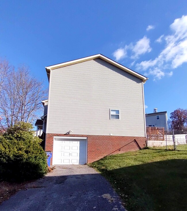 Single-car drive under garage. - 330 Warren St