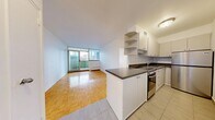 This 560 square foot apartment in downtown Toronto offers a blend of efficiency and urban charm. The space is thoughtfully designed with two bedrooms, including a 110 square foot primary bedroom, a full bathroom, and an open-concept living area. The kitchen, while compact, boasts modern appliances and ample counter space, ideal for culinary enthusiasts.

Throughout the apartment, gleaming parquet flooring adds warmth and character, contrasting beautifully with the crisp white walls. Large windows in the bedrooms and living area flood the space with natural light and frame stunning views of Toronto's iconic skyline, creating a sense of expansiveness within the modest footprint.

The bathroom features clean lines with white tiles and modern fixtures, offering a spa-like retreat. A private balcony provides an outdoor extension to the living space, perfect for enjoying morning coffee or evening relaxation while taking in the urban panorama.

Storage solutions are cleverly integrated, maximizing the use of available space. The apartment's location at 135 Isabella St places residents in the heart of Toronto, offering the perfect balance of home comfort and city living.