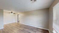 Located at 3708 Garden Oaks Dr in New Orleans, LA, this single-floor, 3-bedroom, 2-bathroom home offers a practical and well-organized layout. The open living room is a standout space, finished with wood-look plank flooring, warm neutral walls, and a ceiling fan overhead, creating a comfortable and airy atmosphere. A hallway connects the living areas to the rest of the home.

The kitchen makes a bold visual statement with striking dark cabinetry contrasted against white countertops and matching black appliances, including a range, dishwasher, and refrigerator. A pass-through window connects the kitchen to the adjacent living area, enhancing the open feel.

The three bedrooms are finished with plush carpeting and neutral-toned walls. Each room is filled with natural light from windows with blinds, and several feature closets for storage. The spacious primary bedroom includes direct access to the hallway.

The two bathrooms are clean and functional. One features a tub-shower combination with large format tile surround and wood-look flooring, while the other includes a vanity with a single-sink, a framed mirror with lighted surround, and matching flooring. Together, these spaces offer a comfortable and move-in ready home in New Orleans.