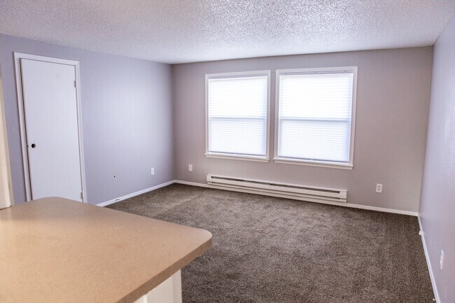 Huge family room with large windows. Lots of natural light! - 3595 S King St