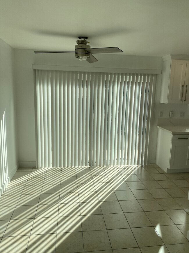 Blinds and Sliding Door Leading to large patio - 6635 Wilbur Ave