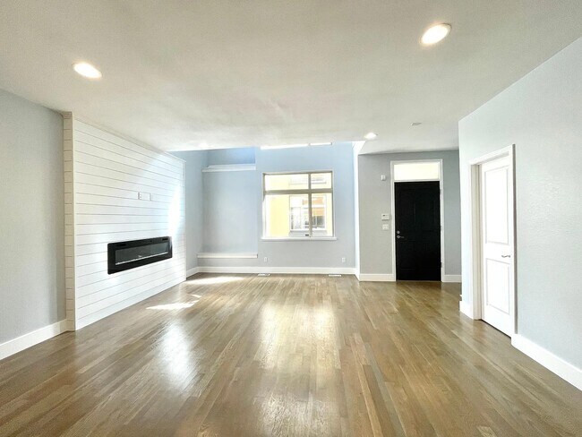 Large living space with new electric fireplace - 1874 Vine St