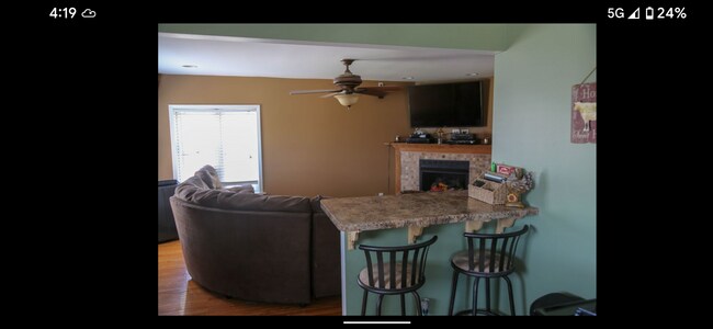 Bar height eating area and view of living room. - 106 W North St