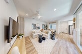 Located at 448 Denton Ave in Vacaville, CA, this thoughtfully designed single-story home offers two bedrooms, one bathroom, and an efficiently utilized floor plan. Light-toned hardwood flooring flows throughout the main living areas, complementing a crisp, neutral color palette and recessed lighting that keeps the space feeling bright and airy.

The open-concept living and dining area is a standout feature, with a ceiling fan, large windows allowing natural light to pour in, and a seamless connection to the kitchen. The kitchen is well-appointed with white shaker cabinetry, a classic subway tile backsplash, stainless steel appliances, and a window above the sink overlooking the outdoors.

The primary bedroom features a distinctive patterned accent wall, a sliding closet, and direct access to adjacent spaces. The second bedroom is accented with soft teal walls and a bright window with views of the fenced yard. The shared bathroom offers a frameless glass walk-in shower, white cabinetry with matte black hardware, and tile flooring.

The attached garage houses a stacked washer and dryer unit and provides interior access to the home. A private outdoor patio extends the living space, offering a covered seating area with a fenced yard — ideal for relaxing outdoors.