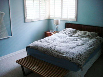 Master bedroom showing a queen size bed. - 12133 Marshall St