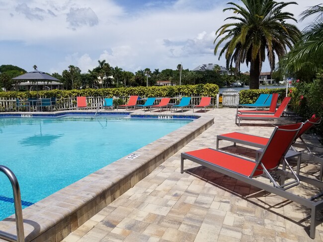 Relax poolside - Sand Cove Apartment Homes