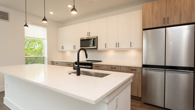 Kitchen with island and hard surface flooring - Lyle