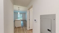 Located at 5401 Lankershim Blvd in North Hollywood, California, this modern single-floor residence offers a clean, contemporary design throughout. Light wood-tone flooring flows seamlessly across all living areas, complementing the bright white walls and creating a cohesive, airy ambiance.

The open-concept living and kitchen area serves as the heart of the home. The kitchen is outfitted with white shaker-style cabinetry, quartz countertops, a subway tile backsplash, and a full suite of stainless steel appliances including a gas range, microwave, dishwasher, and refrigerator. A central island with pendant lighting provides additional prep space and connects naturally to the dining and living areas, where natural light streams in through large windows with blinds.

The residence includes multiple bedrooms, each featuring wood-look flooring, crisp white walls, and windows that invite natural light. Two well-appointed bathrooms serve the unit: one with a soaking tub and subway-tiled shower surround, and another featuring a glass-enclosed walk-in shower, both with wood-toned vanities and quartz countertops. A dedicated in-unit laundry closet houses a stacked Whirlpool washer and dryer, adding everyday convenience to this thoughtfully designed home.