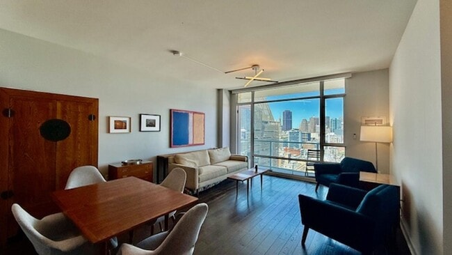 Building Photo - FURNISHED Modern 1BR + Den/1BA w/ Breathta...