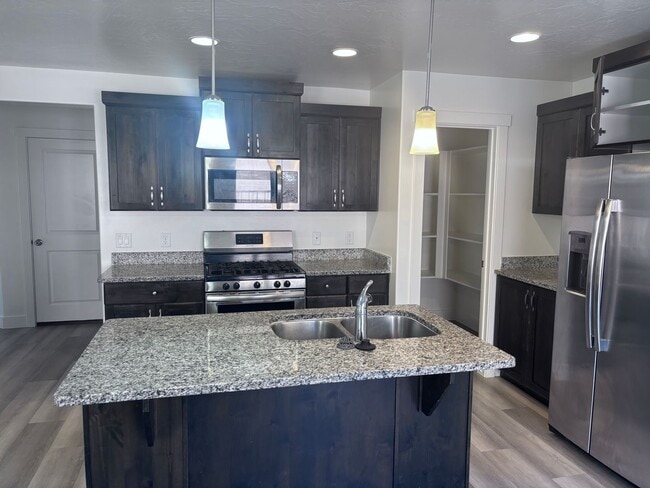Building Photo - 4bd | 2.5 Bath | 2 Car Detached Desert Canyon Townhome Now Available