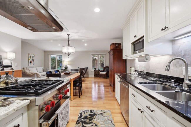 Kitchen space flows easily to dining and living areas - 245 Inland Ln N