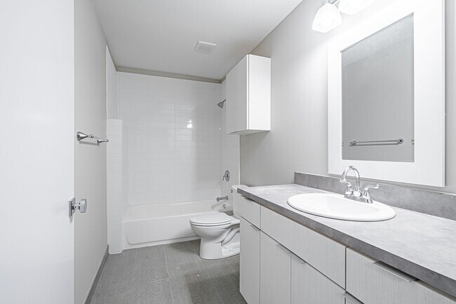 Spacious bathroom with tile shower - 831 S French Ave