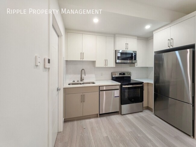 Photo du bâtiment - BRAND NEW 2 BEDS, 1 BATH BASEMENT SUITE | CENTRAL AC | PRIME BOWNESS LOCATION