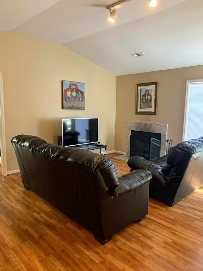 Living room with fireplace and vaulted ceiling. - 3100 Anderson Pike