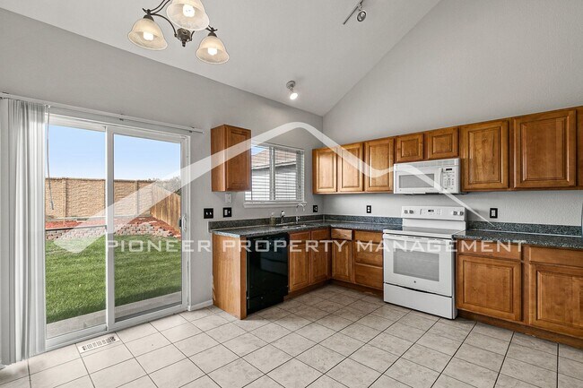 Building Photo - Spacious Home with Fenced Yard and 2 Car G...