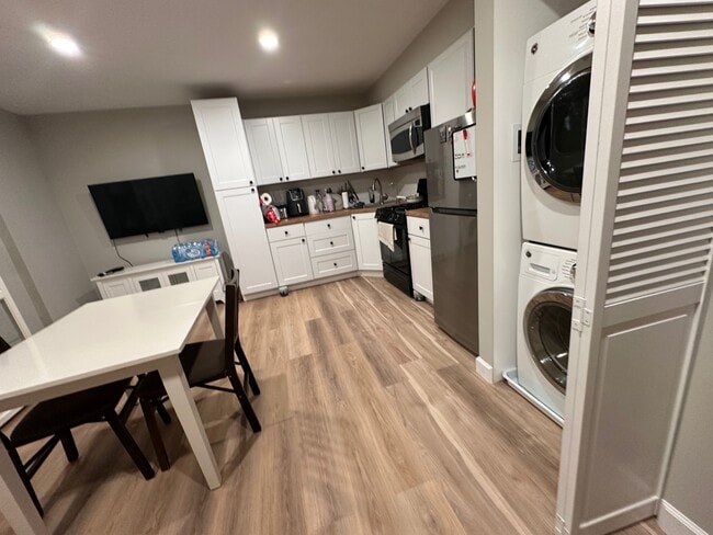 kitchen -tv cabinets, stove, refrigerator - 3846 Farrcroft Grn